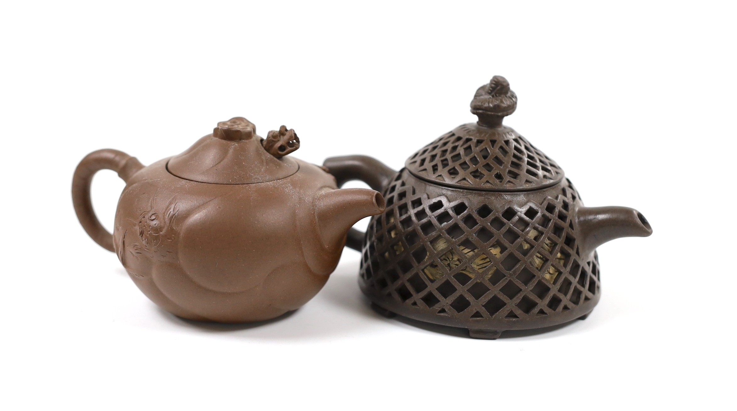 A Chinese Yixing reticulated teapot and cover and another
